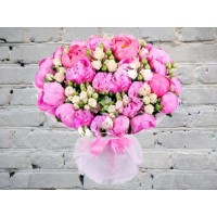 Bouquet of bright peonies and bush roses
