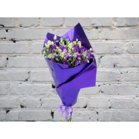 A Bouquet of Purple Lisianthus in a Bright Package
